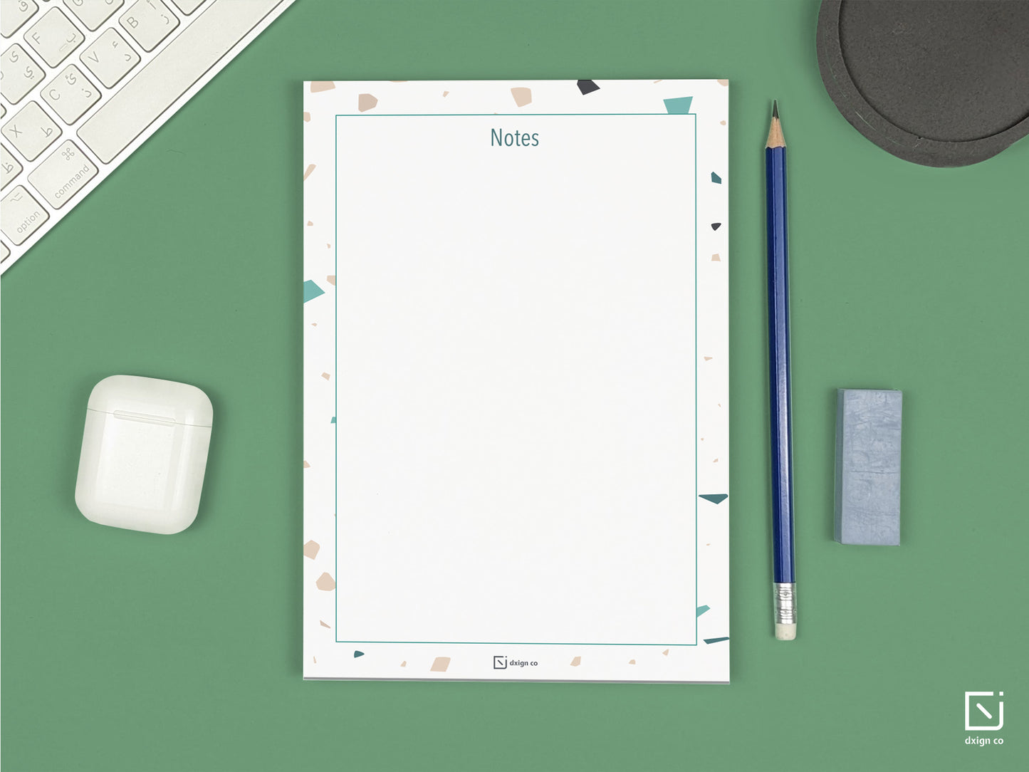 terrazzo print cream beige green design personalised notepad on a desk