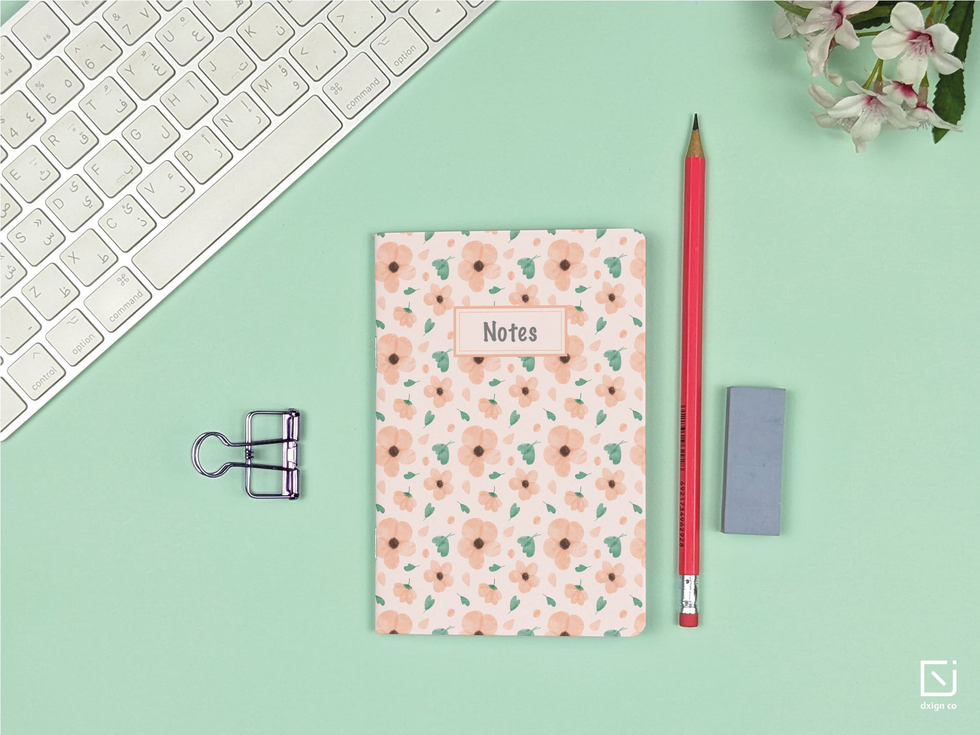 tahitian sunset pink flowers design personalised small notebook on a desk