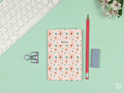 tahitian sunset pink flowers design personalised small notebook on a desk