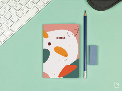 pink and green retro abstract design personalised small notebook on a desk