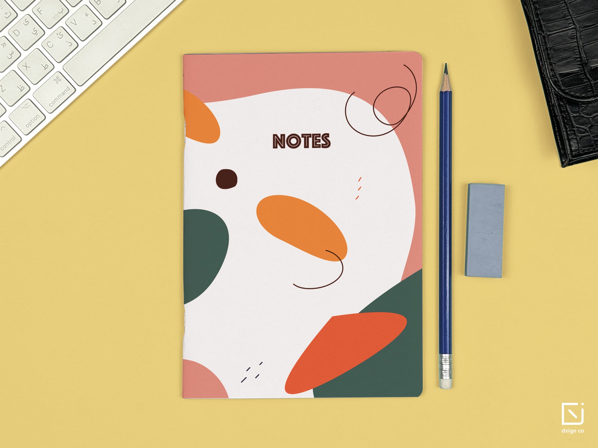 pink and green retro abstract design personalised notebook on a desk