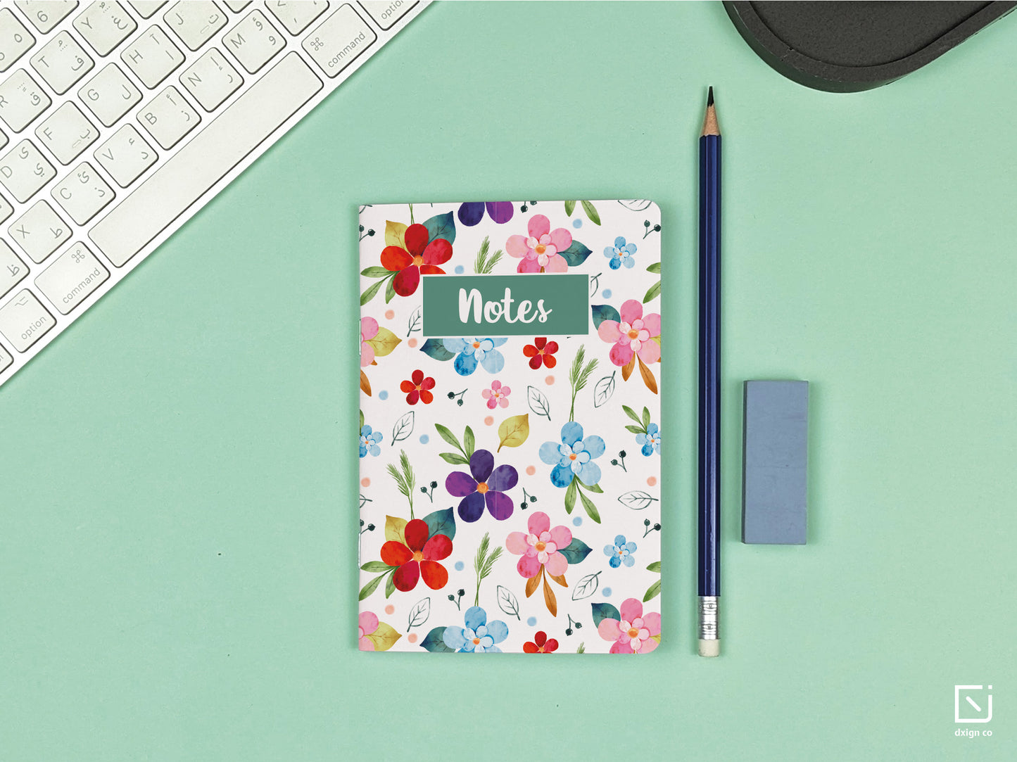 pentunia vibrant coloured flowers design personalised small notebook on a desk