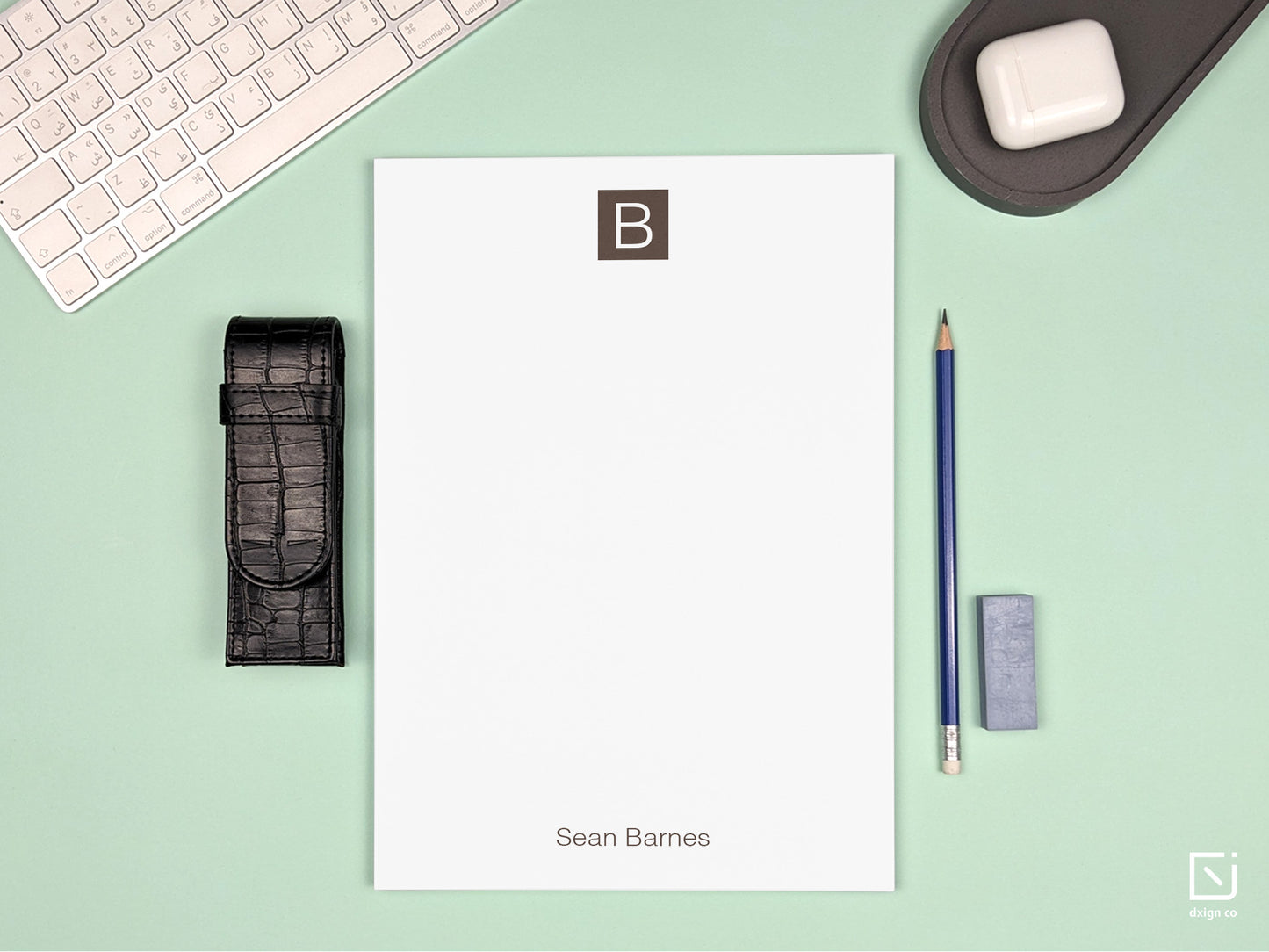 block monogram single initial with name personalised large notepad on a desk