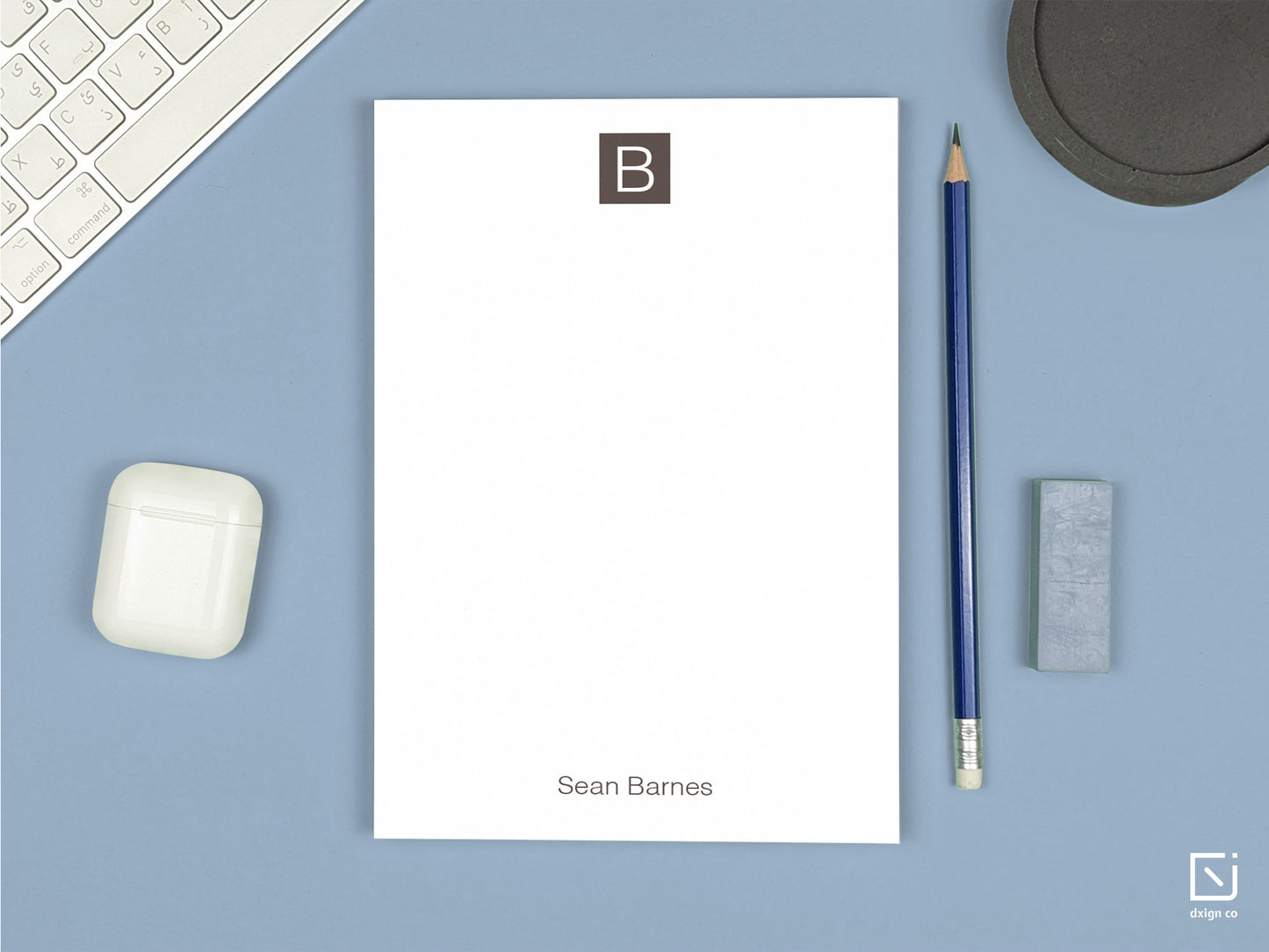 block monogram single initial with name personalised notepad on a desk