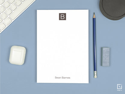 block monogram single initial with name personalised notepad on a desk
