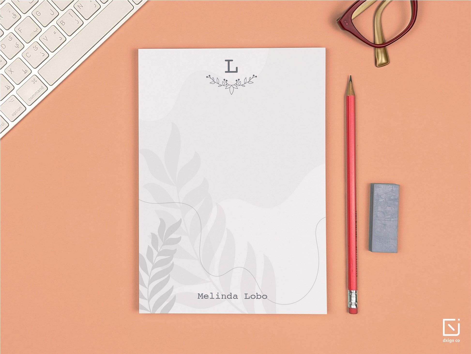 floral leaves monogram single initial with name personalised notepad on a desk