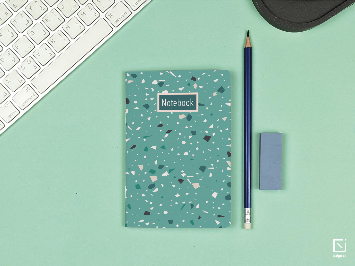 terrazzo print green design personalised small notebook on a desk