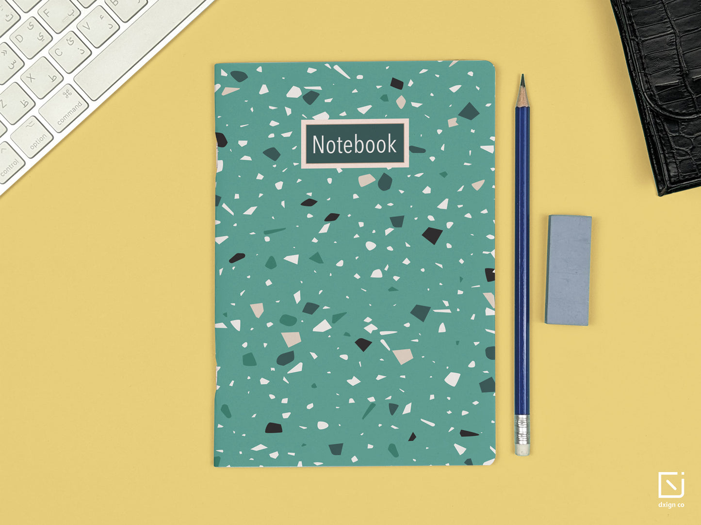 terrazzo print green design personalised notebook on a desk